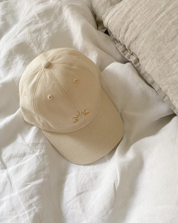 The July Co undyed 100% organic cotton cap with logo embroidery to the front and back.