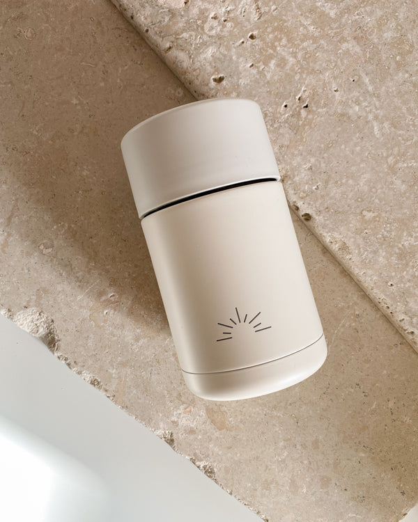 The July Co reusable ceramic cup in cloud white colour by The July Co in collaboration with Frank Green. Stainless steel cups with a ceramic lining, triple walled, leak proof and keeps beverages hot or cold and features an engraved sun logo design.