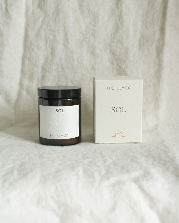 The July Co Sol Sustainable Rapeseed and Coconut Wax Candle Mediterranean Fig Leaf, Cedar, Sandalwood, Amber and Musk with box packaging. 180ml 6oz